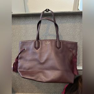 kate spade pebbled leather tote with suede tassels